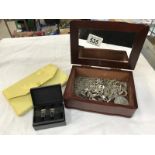 A jewellery box containing white metal chains & pearls etc.