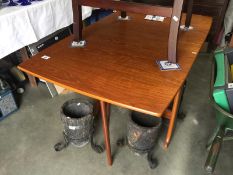 A teak drop leaf dining table