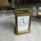 A brass carriage clock.