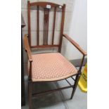 A mahogany inlaid elbow chair.