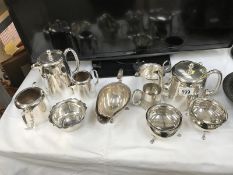 A selection of silver plated tea ware & a sauce boat,