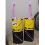 A pair of vintage Nenette dust absorbing polisher tins