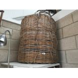 A very large wicker log basket