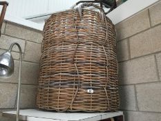 A very large wicker log basket