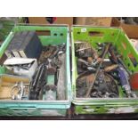2 boxes of classic car tools and parts including micrometers, exhaust mounts etc.