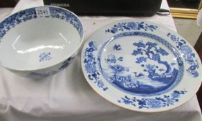 A Chinese blue and white willow pattern plate and a blue and white a/f bowl.