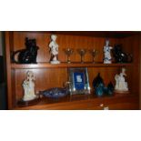 2 shelves of ornaments including 2 Poole pottery dolphins, 2 black cat teapots, a Murano swan bowl,