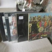4 Beatles LP records.