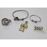 A silver gilt cross, 2 bracelets and 3 integral silver rings.