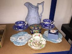 A mixed lot of china including cups, saucers, lidded pots etc.
