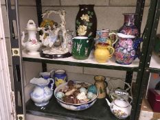 2 shelves of porcelain including jugs, teapots etc.