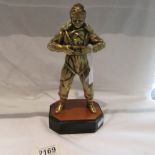 A heavy brass figure of a fighter pilot.