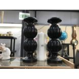 2 large candlestick holders,