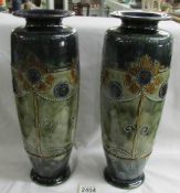 A pair of early Doulton vases bearing marks for E Violet Hayward.