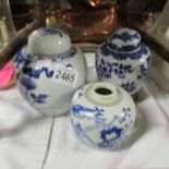 3 blue and white ginger jars (one missing lid).