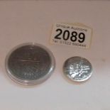 A 2011 £1 half ounce pure silver coin and a 2011 £5 Olympics coin.