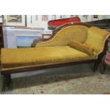 A mahogany framed chaise longue.