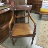 A mahogany elbow chair.