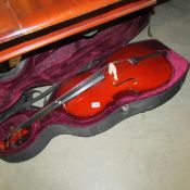 A cello strung left handed has repair to neck A/F with case