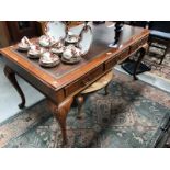 A leather topped desk (no key middle drawer is locked)