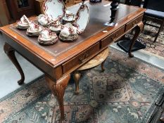 A leather topped desk (no key middle drawer is locked)