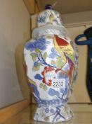An early 20th century Mason's Ironstone lidded jar decorated with exotic birds.