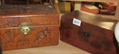 A carved wood box and a mahogany box.