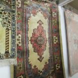 An oriental rug, 1.78 x .98 cm.
