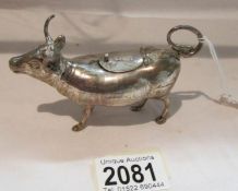 A small silver bull cream jug, marked sterling 925.
