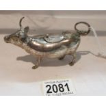 A small silver bull cream jug, marked sterling 925.