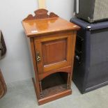 A mahogany pot cupboard.