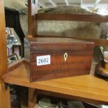 A rosewood tea caddy.