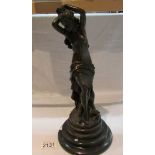 A bronze figure of a semi nude lady, unsigned.