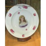 A large cabinet plate with portrait of a lady.