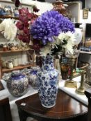 A blue & white flower pattern vase with faux flowers