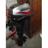 A 2004 Mariner 15 outboard motor