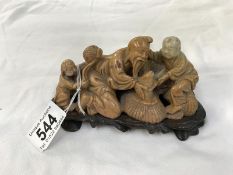 A carved soapstone figure group