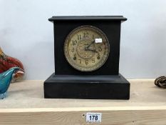 A black lacquered Edwardian mantle clock (glass A/F)