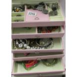 A mixed lot of costume jewellery in a pink jewellery box.