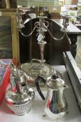A silver plate candelabra, tureen and 2 water jugs.