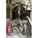 A silver plate candelabra, tureen and 2 water jugs.