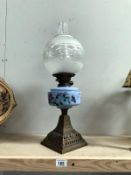 A Victorian oil lamp on cast base