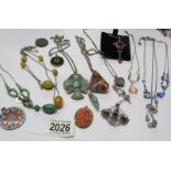 A mixed lot of vintage pendants and necklaces etc.