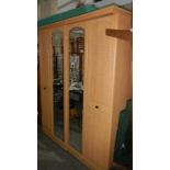 A beech effect 4 door wardrobe