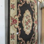 A blue patterned rug.