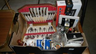 A box of miscellaneous including a cased cutlery set, digital clock,