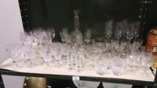 A quantity of drinking glasses including crystal.