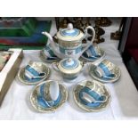 A Tokyo china coffee set with blue and white gold edges
