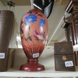 A 19th century hand painted glass vase.