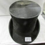 An old black silk top hat.
